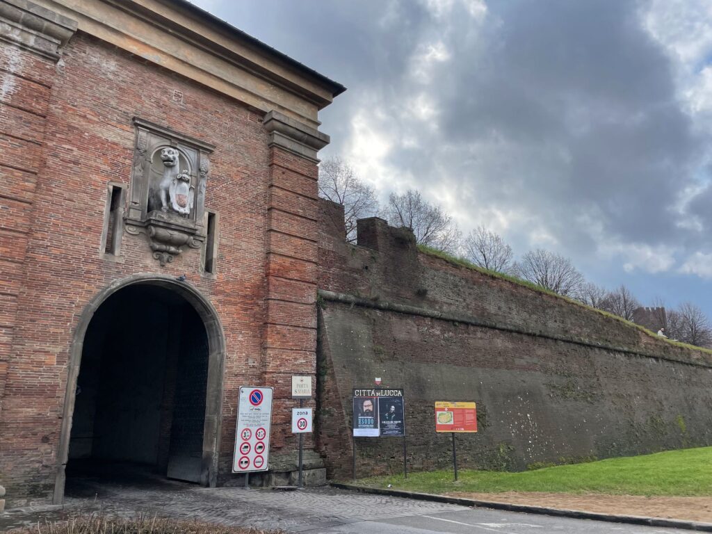 The Porta Santa Maria on a February day in 2023, during winter: leafless trees and an imposing scenery