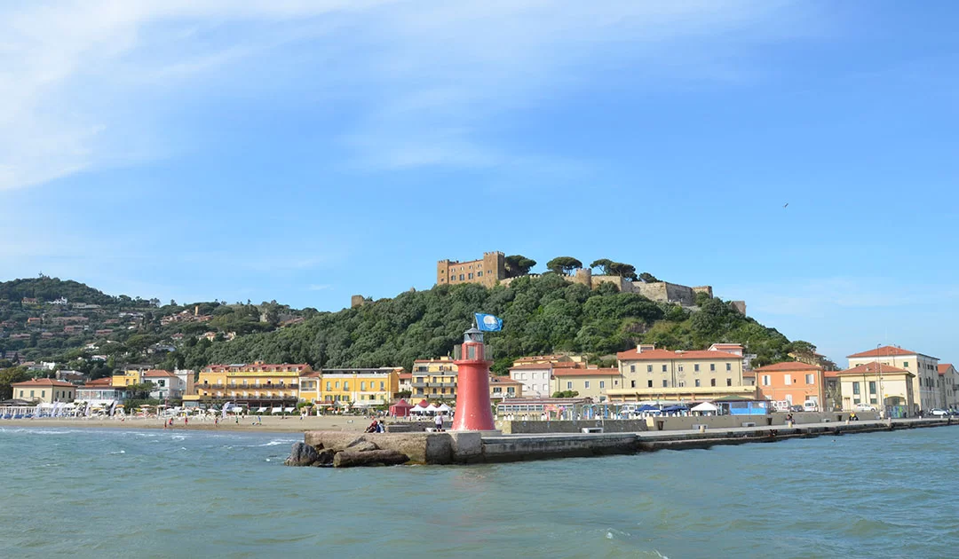 Discovering Castiglione della Pescaia: Tuscany's Hidden Gem 1 A swim with a view of a castle in Castiglione della Pescaia