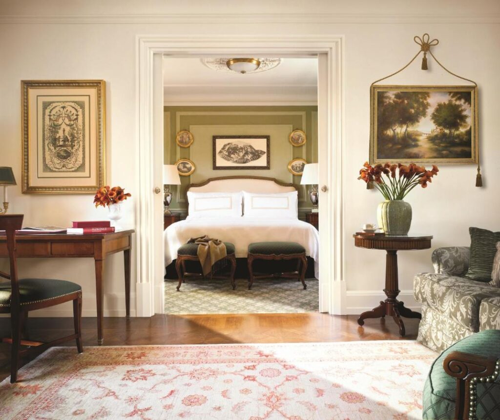 The 7 Best Luxury Hotels in Florence 14 Refined suite at Four Seasons Hotel Firenze featuring a spacious bedroom, vintage decor, and artistic details.