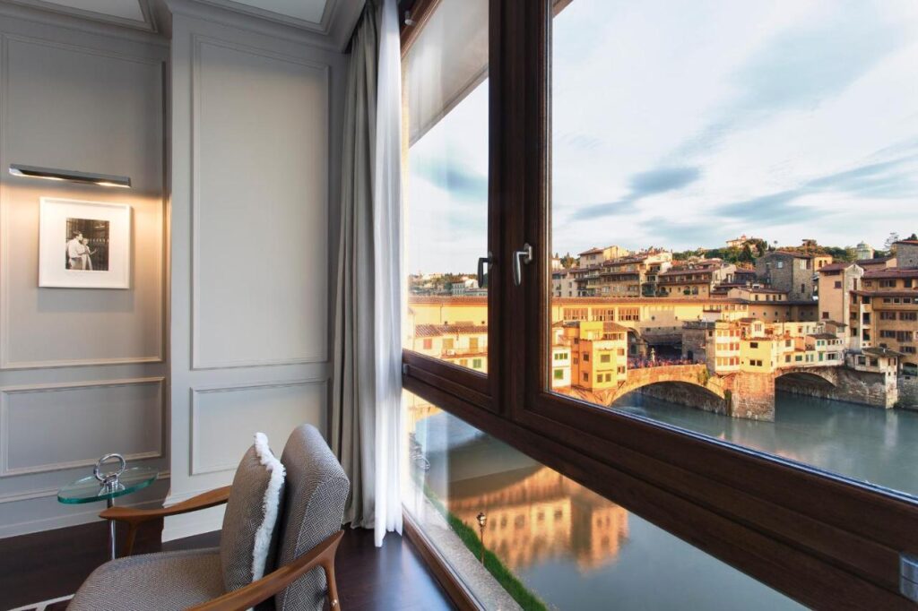 The 7 Best Luxury Hotels in Florence 26 Unforgettable window view of Ponte Vecchio and the Arno River from the Portrait Firenze hotel in Florence.