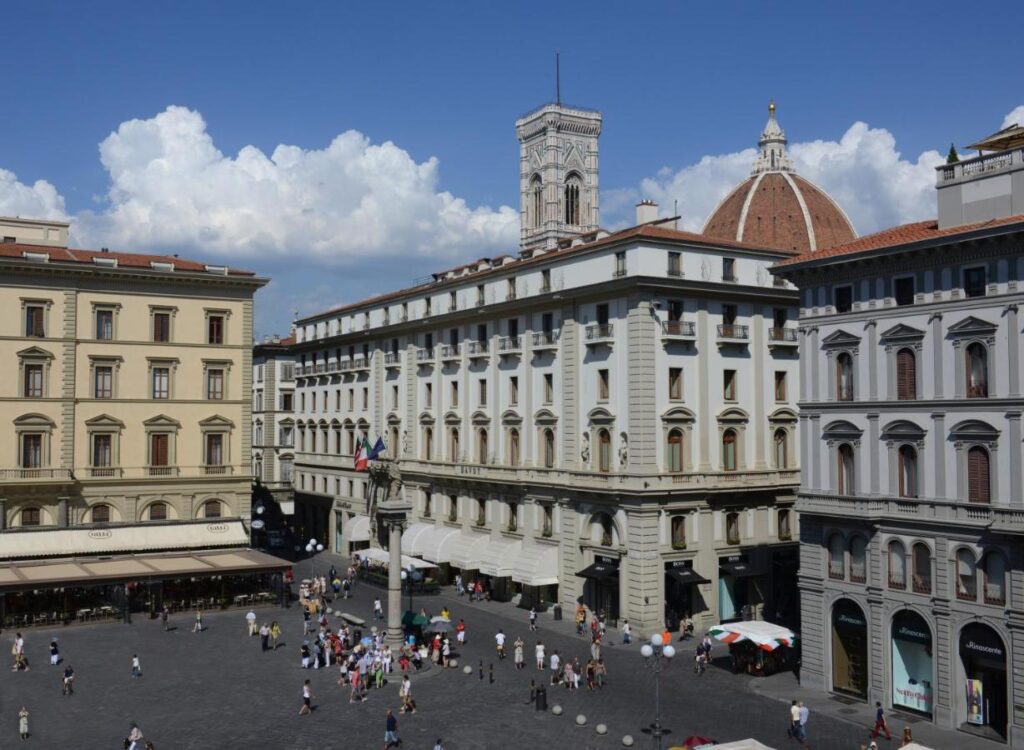 The 7 Best Luxury Hotels in Florence 6 Exterior view of Hotel Savoy Florence facing Piazza della Repubblica, with the Duomo and Giotto’s bell tower in the background.