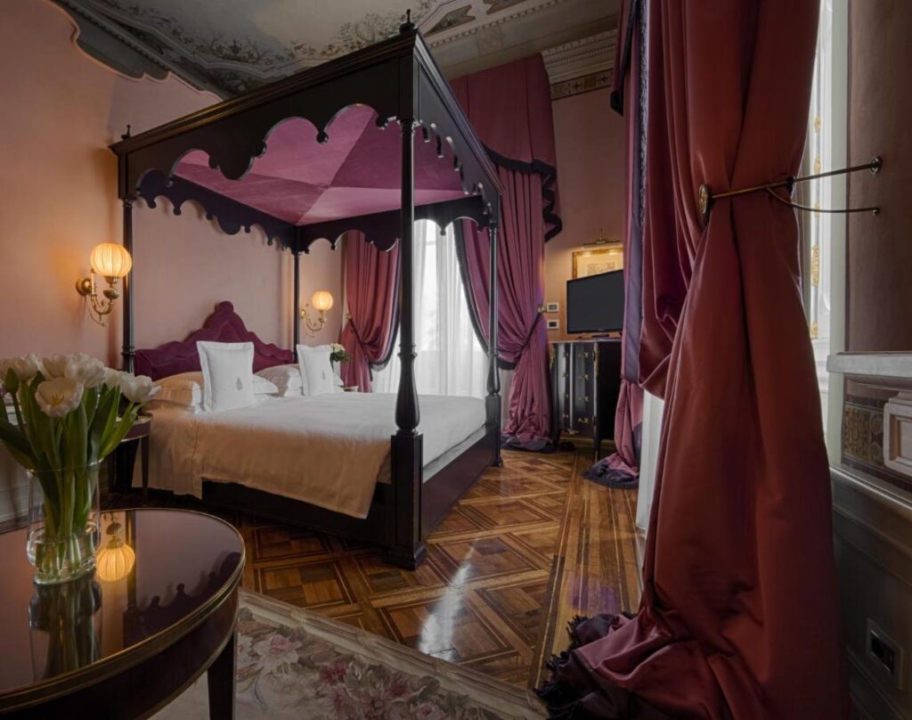 The 7 Best Luxury Hotels in Florence 21 Luxurious four-poster bed with rich purple drapes at Villa Cora in Florence, Italy.