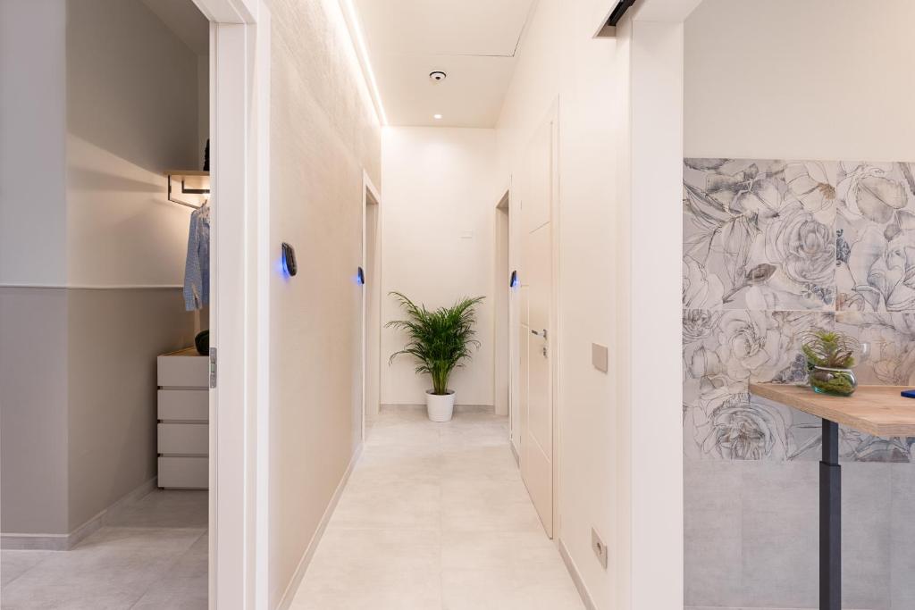 Where to Stay in Follonica: B&B Oltremare, a Top Choice on the Tuscan Coast 5 Bright hallway with modern decor inside B&B Oltremare, Follonica.