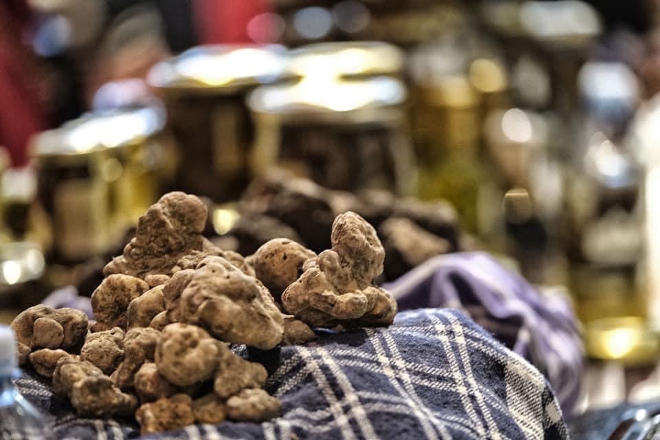 White truffles displayed at a Tuscan market during truffle season.