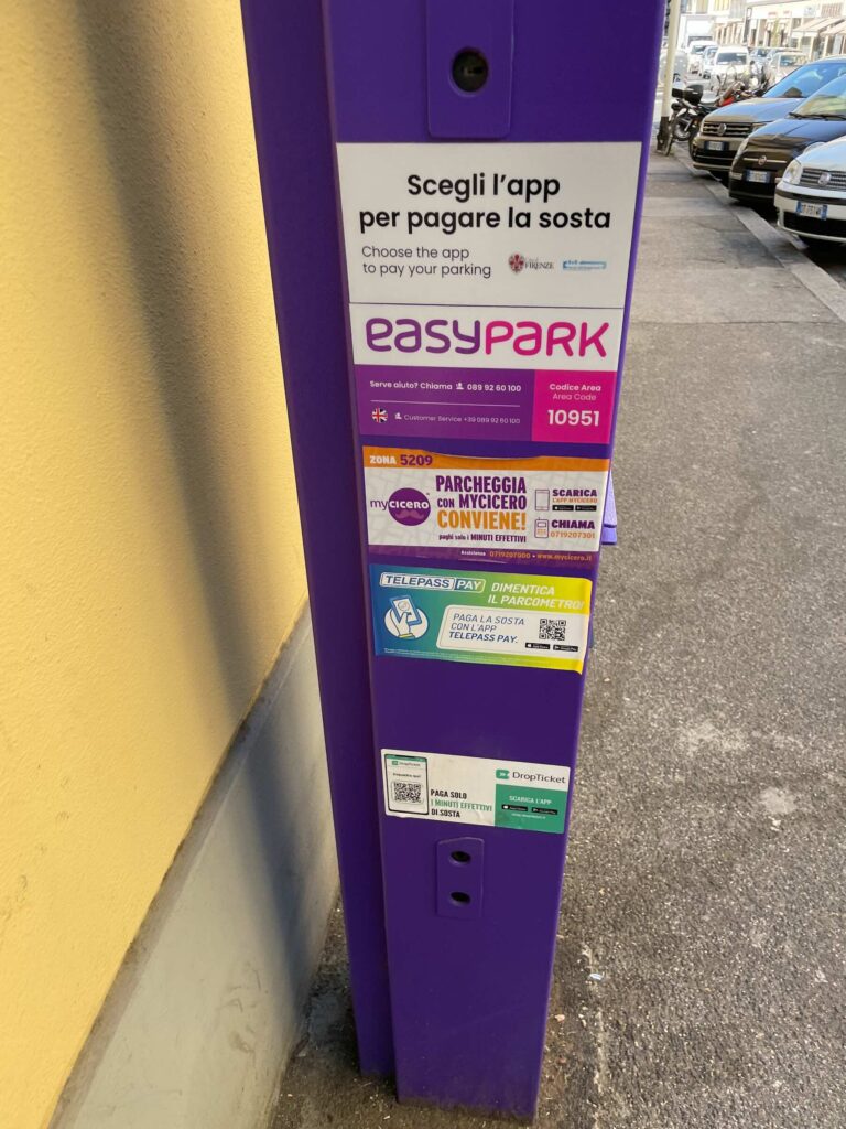 Parking meter in Florence displaying app options for payment, including EasyPark, myCicero, Telepass Pay, and DropTicket.