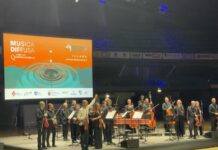 Musica Diffusa: Vivaldi’s “The Four Seasons” Lights Up Florence The Orchestra della Toscana on stage at the Nelson Mandela Forum in Florence, with conductor and violinist Giacomo Bianchi raising his bow to thank the audience during the Musica Diffusa concert featuring Vivaldi’s The Four Seasons.