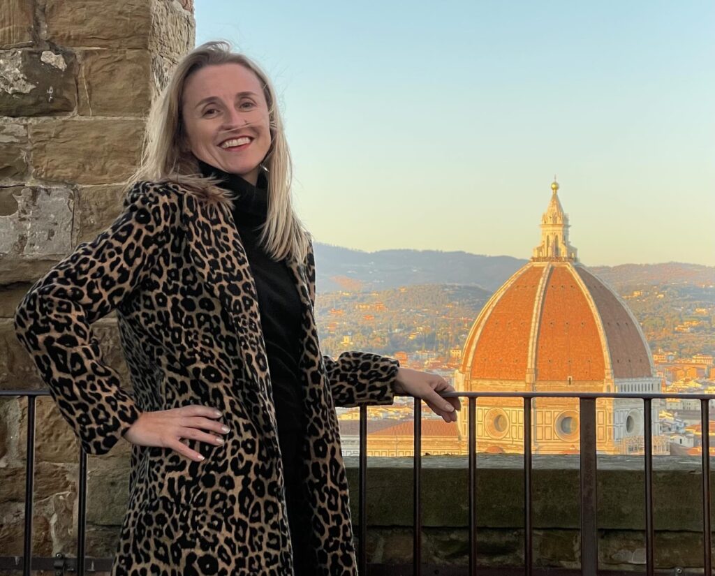 Travel creator in Florence, Tuscany, explaining why using travel blogger promo codes helps support independent travel guides.