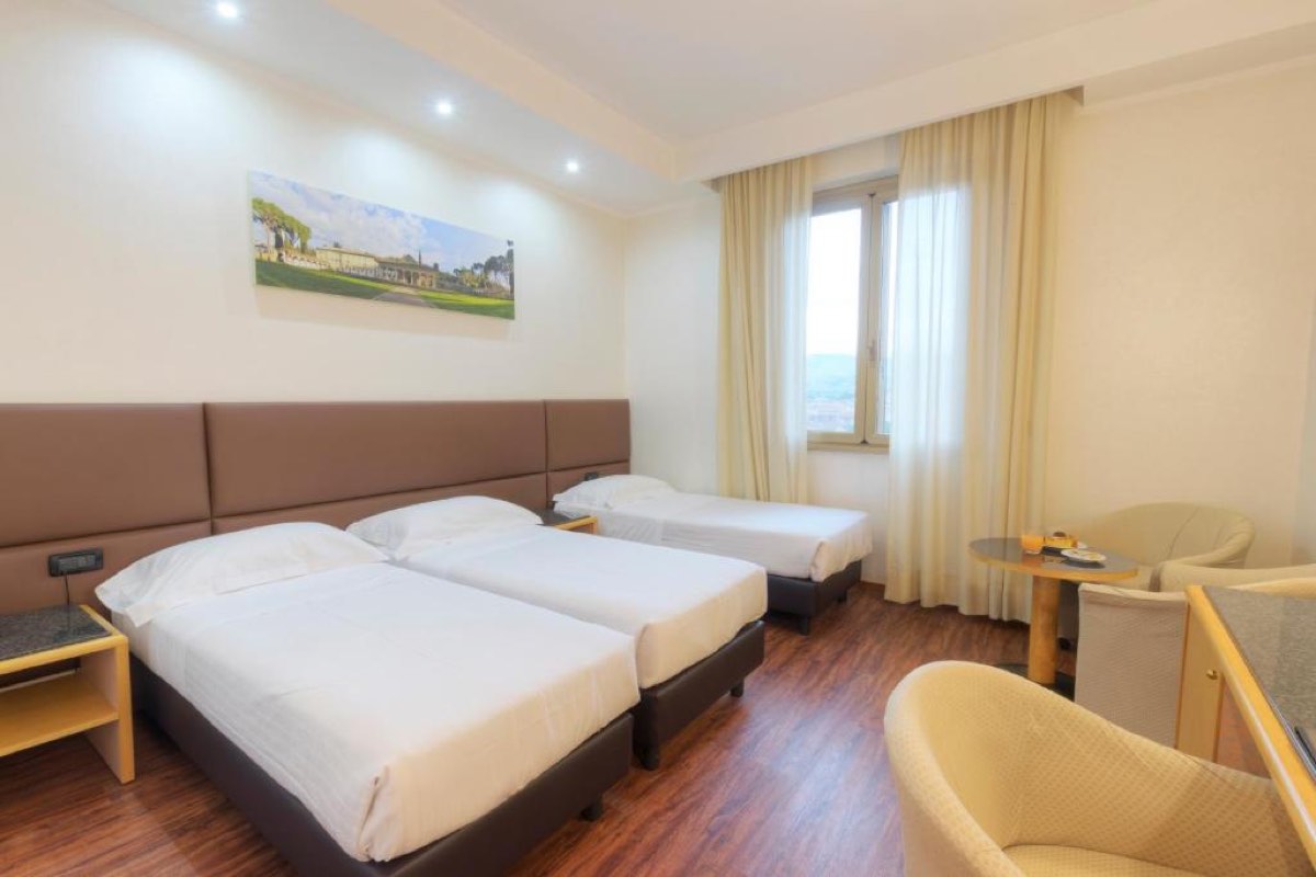 Best Arezzo Hotels for a Memorable Stay in Tuscany 28 Triple room with a view over the hills at Hotel Minerva, Arezzo