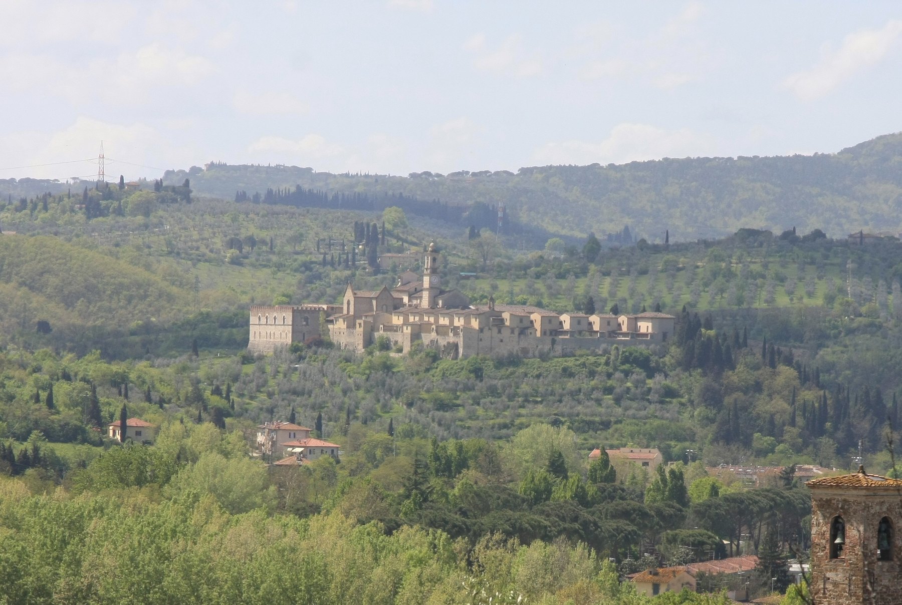Autunno Fiorentino 2026: The Best Events Beyond Florence's Historic Center 1 The Certosa di Firenze on its hilltop among olive groves and cypresses, seen from the hills south of Florence