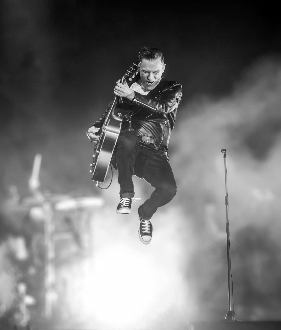 Bryan Adams in Florence 2027: Bare Bones Tickets at Teatro del Maggio 2 Bryan Adams live on stage with his guitar