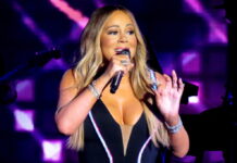 Mariah Carey in Lucca 2027: Tickets and Concert Travel Guide Mariah Carey singing live onstage during a 2019 concert